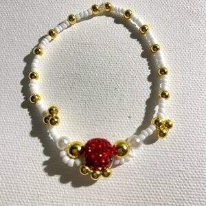 White and Gold Beaded Bracelet with Red Accent